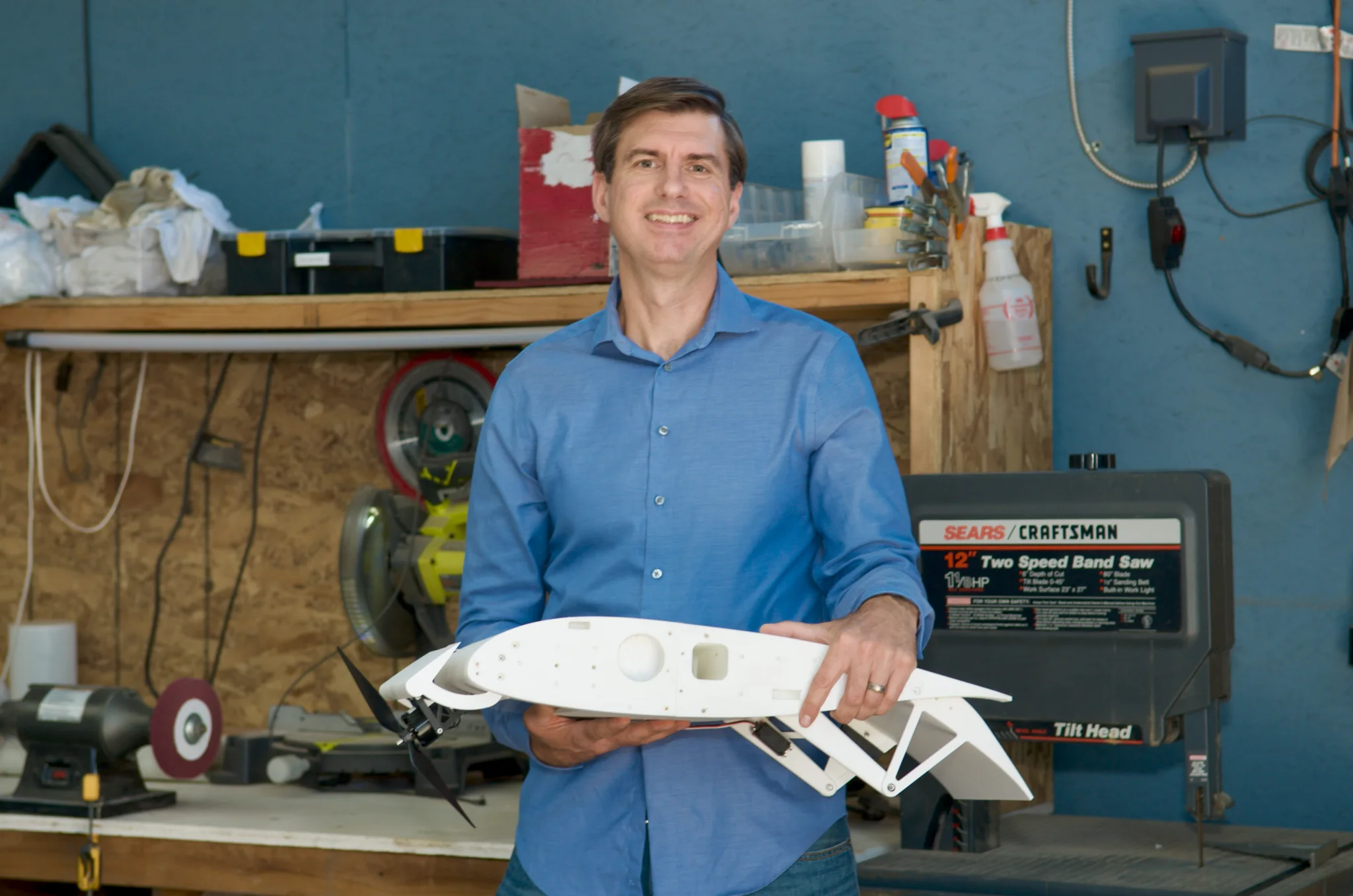 Wayfarer Aircraft founder holding a model of the Waylift system
